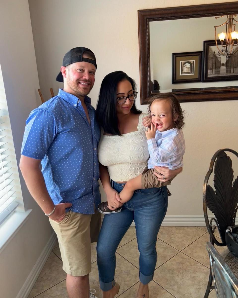 Alyssa Prince, owner of Omybrownies, and her husband Cody Prince take an Easter Day photo with their son, Grayson.