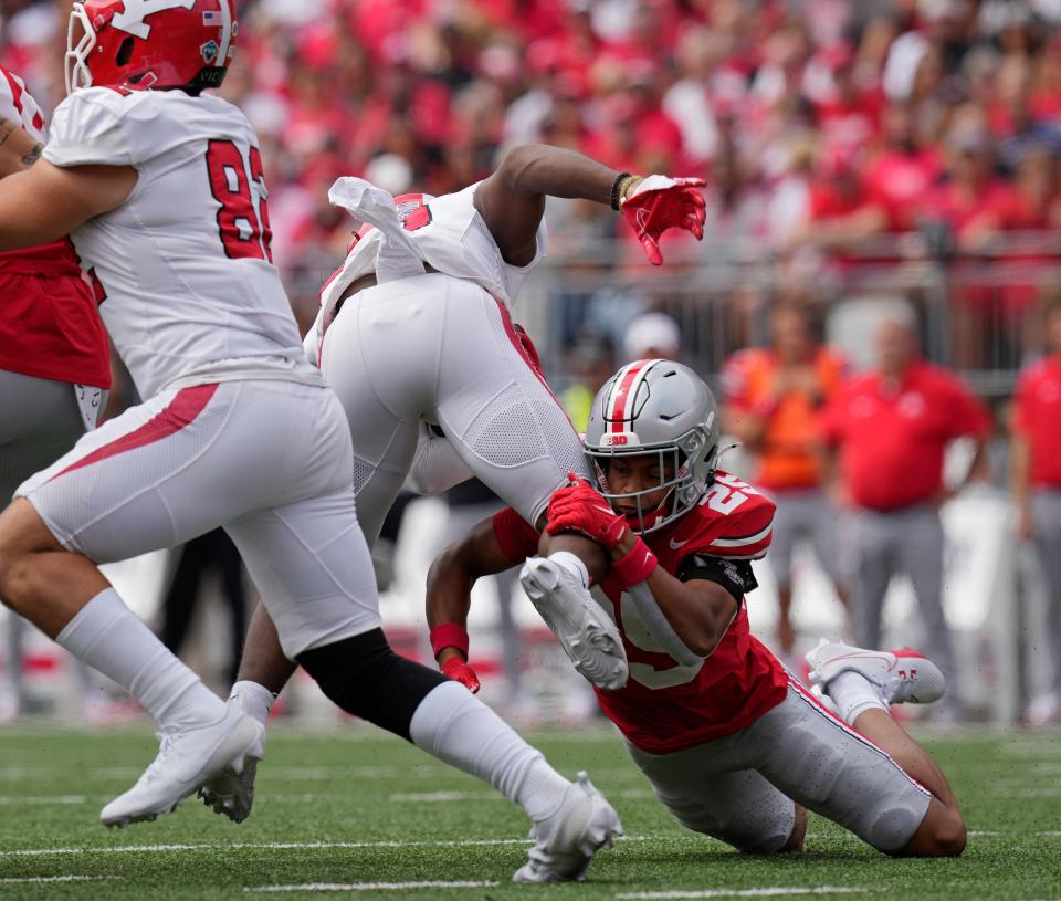 Sept. 9, 2023; Columbus, Oh., USA; 
Youngstown State Penguins running back Tyshon King (10) is tackled by Ohio State Buckeyes safety Malik Hartford (25) during the first half of Saturday's NCAA Division I football game at Ohio Stadium.