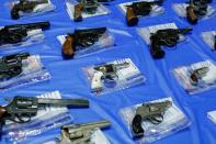 FILE PHOTO: Guns are displayed after a gun buyback event organized by the NYPD, in the Queens borough of New York City