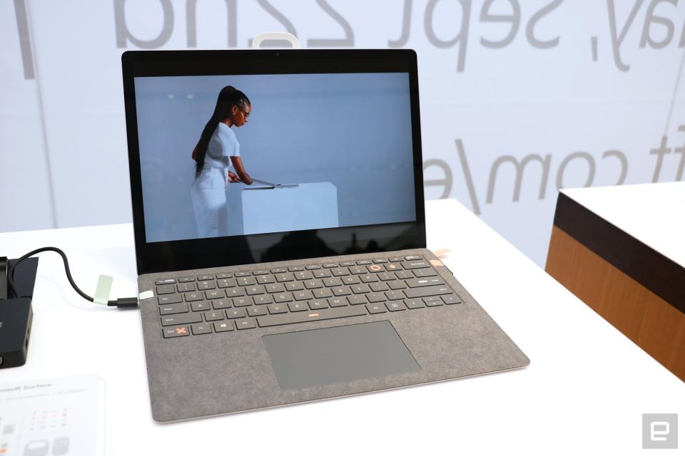 <p>An off-angle shot of the Surface Pro with labels and stickers from the Adaptive Kit attached to its charging cables and space bar, left control key and the P and O buttons.</p>
