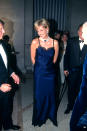 <p>Way before they were ubiquitous, Diana rocked up to the 1995 Met Gala in a lace-trimmed, navy slip dress, wowing guests and fashion critics alike. (Getty Images)</p> 