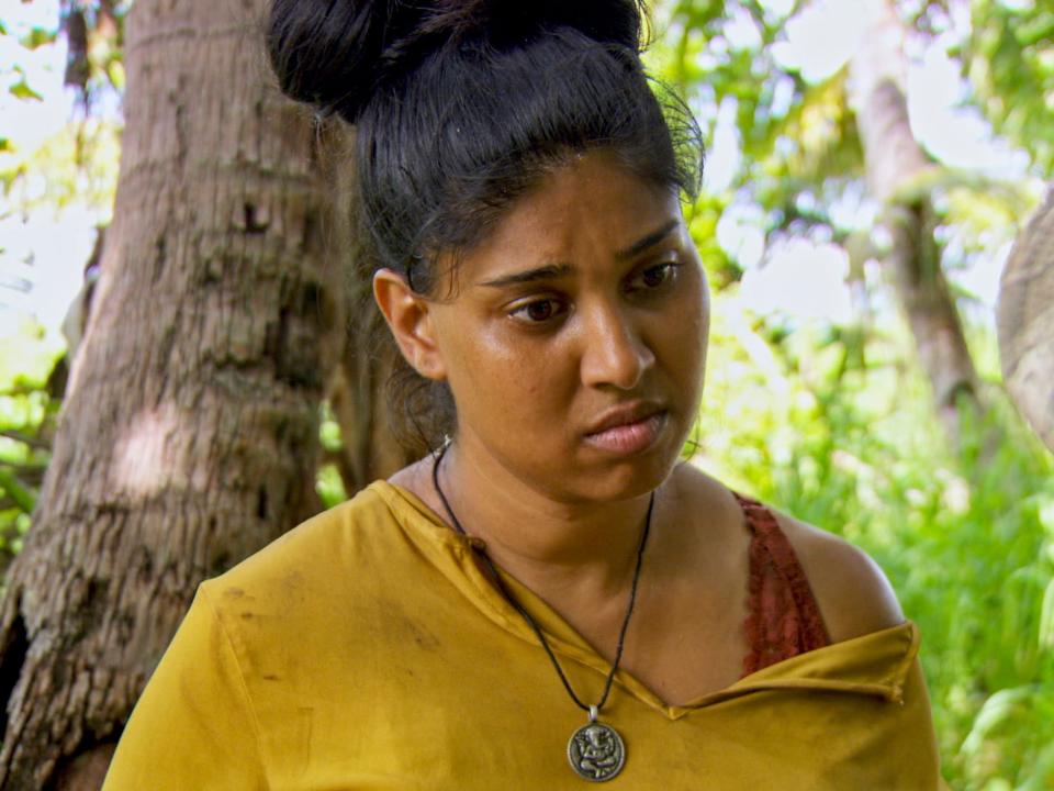 Karishma Patel looking sad and concerned in a close-up on survivor