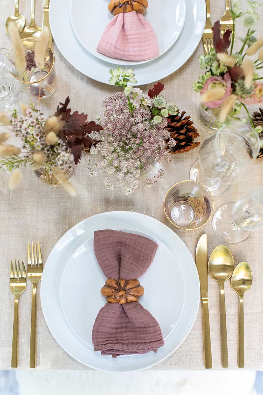 <p>Muted shades of purple and pink add a romantic flair to a table otherwise set with neutral colors and subtle fall details. </p><p><strong><em><a href="https://sugarandcharm.com/beautiful-fall-thanksgiving-table-setting" rel="nofollow noopener" target="_blank" data-ylk="slk:Get the tutorial at Sugar and Charm;elm:context_link;itc:0;sec:content-canvas" class="link ">Get the tutorial at Sugar and Charm</a>. </em></strong></p><p><a class="link " href="https://go.redirectingat.com?id=74968X1596630&url=https%3A%2F%2Fwww.williams-sonoma.com%2Fproducts%2Fpumpkin-napkin-rings&sref=https%3A%2F%2Fwww.womansday.com%2Fhome%2Fdecorating%2Fg23289609%2Fthanksgiving-table-setting-ideas%2F" rel="nofollow noopener" target="_blank" data-ylk="slk:SHOP PUMPKIN NAPKIN RINGS;elm:context_link;itc:0;sec:content-canvas">SHOP PUMPKIN NAPKIN RINGS</a></p>