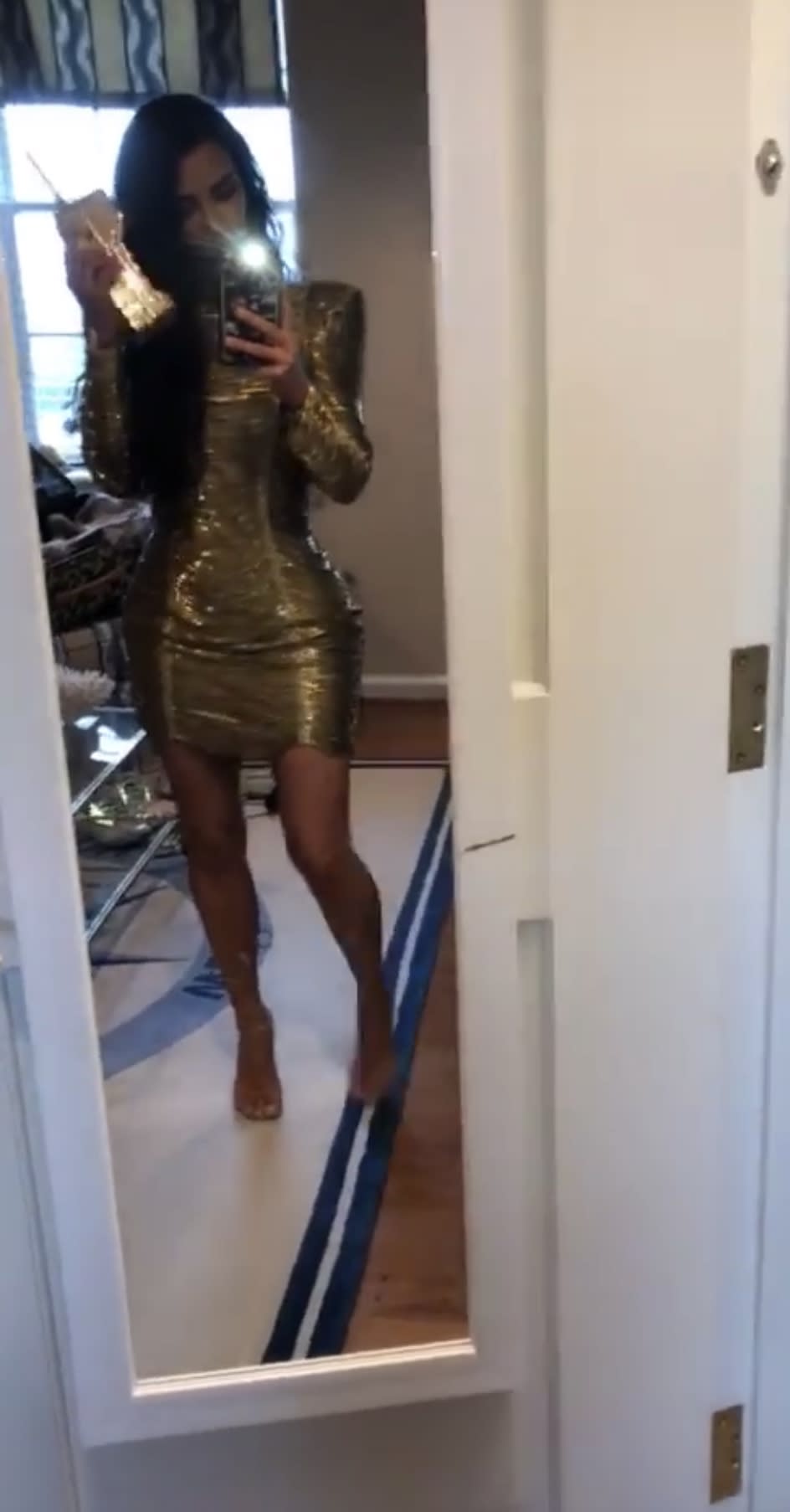 Kim Kardashian in her gold minidress. Photo: Instagram/KimKardashianWest