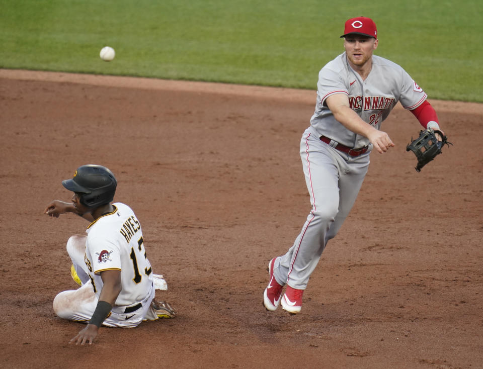 Cincinnati Reds third baseman Brandon Drury throws to first after forcing out Pittsburgh Pirates' Ke'Bryan Hayes at second on the front end of a double play hit into by Bryan Reynolds during the third inning of a baseball game Thursday, May 12, 2022, in Pittsburgh. (AP Photo/Keith Srakocic)