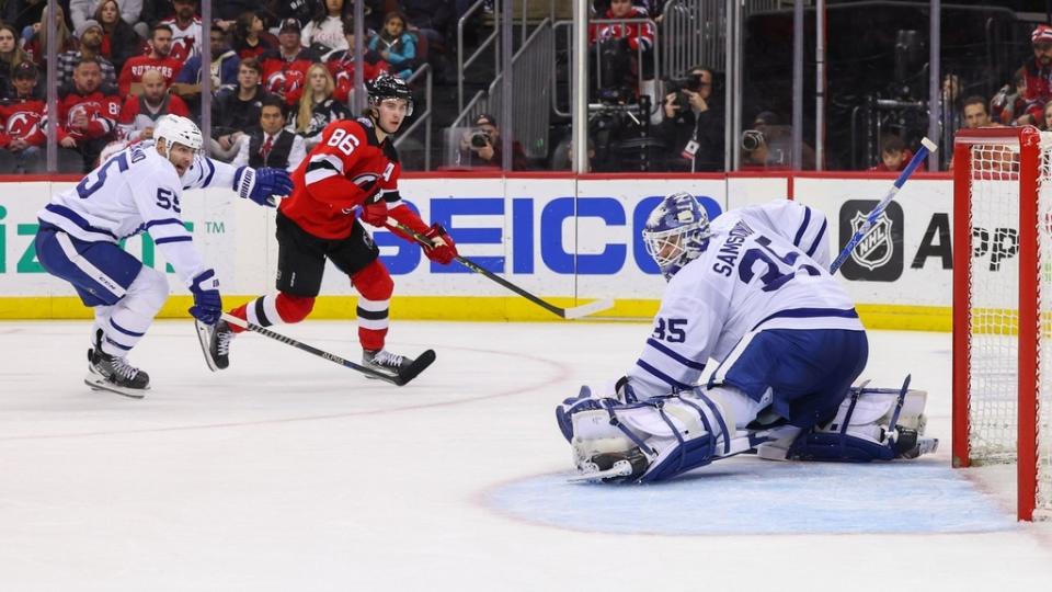 Toronto Maple Leafs goaltender Ilya Samsonov makes a save on New Jersey Devils center Jack Hughes.