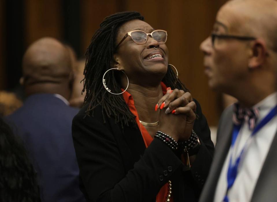 Erika Barrow, former girlfriend to Lamar Johnson, reacts on Tuesday, Feb. 14, 2023, after St. Louis Circuit Judge David Mason vacated his murder conviction during a hearing in St. Louis, Mo. Johnson served nearly 28 years of a life sentence for a killing that he has always said he didn’t commit.