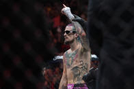 Sean O'Malley celebrates after defeatting Marlon Vera in bantamweight bout to retain his title, at the UFC 299 mixed martial arts event early Sunday, March 10, 2024, in Miami. (AP Photo/Wilfredo Lee)