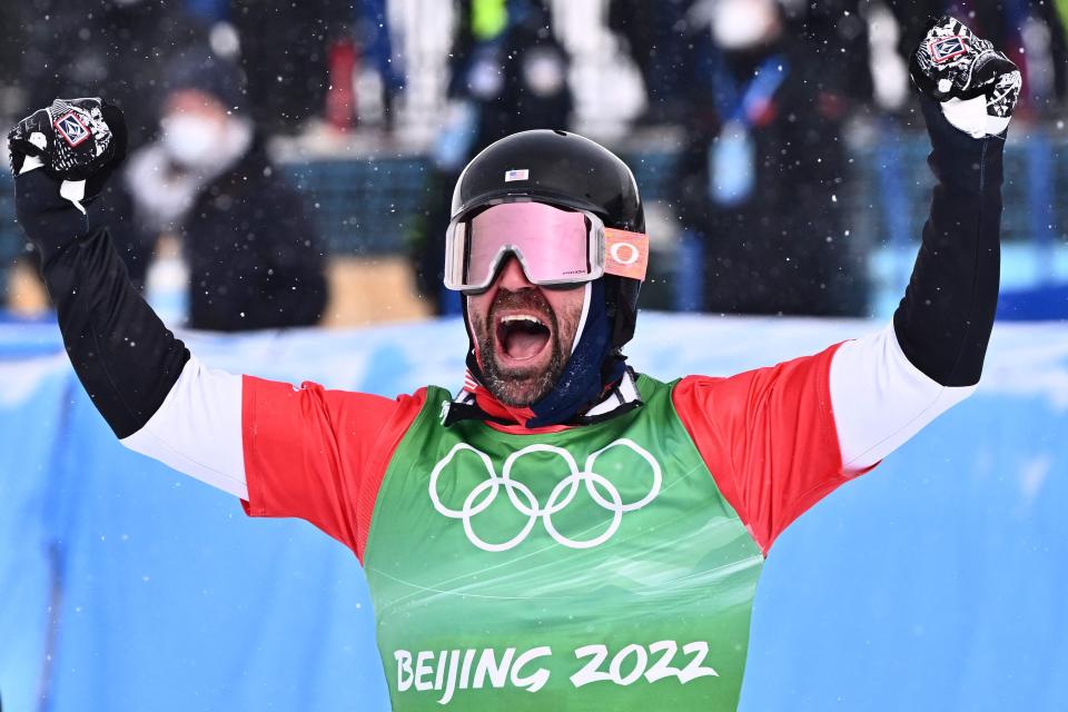 USA's Nick Baumgartner celebrates winning the snowboardcross big final during the 2022 Winter Olympics at the Genting Snow Park P & X Stadium in Zhangjiakou, China on Feb. 12, 2022.