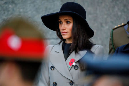 Meghan Markle, the fiancee of Britain's Prince Harry, attends the Dawn Service at Wellington Arch to commemorate Anzac Day in London, Britain, April 25, 2018. Tolga Akmen/Pool via Reuters