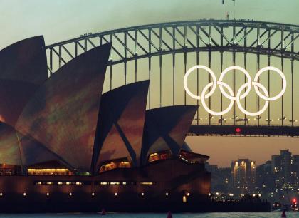 FILE - In this Sept. 14, 2000 file photo the Olympic Rings glow on the the Sydney Harbour Bridge the day before the opening of the 2000 Olympic Games in Sydney. The five massive rings from the Sydney Harbour Bridge that were the focal point of celebrations during the 2000 Olympics have been sold on eBay for 21,000 Australian dollars ($17,000). (AP Photo/Rob Griffith, File)