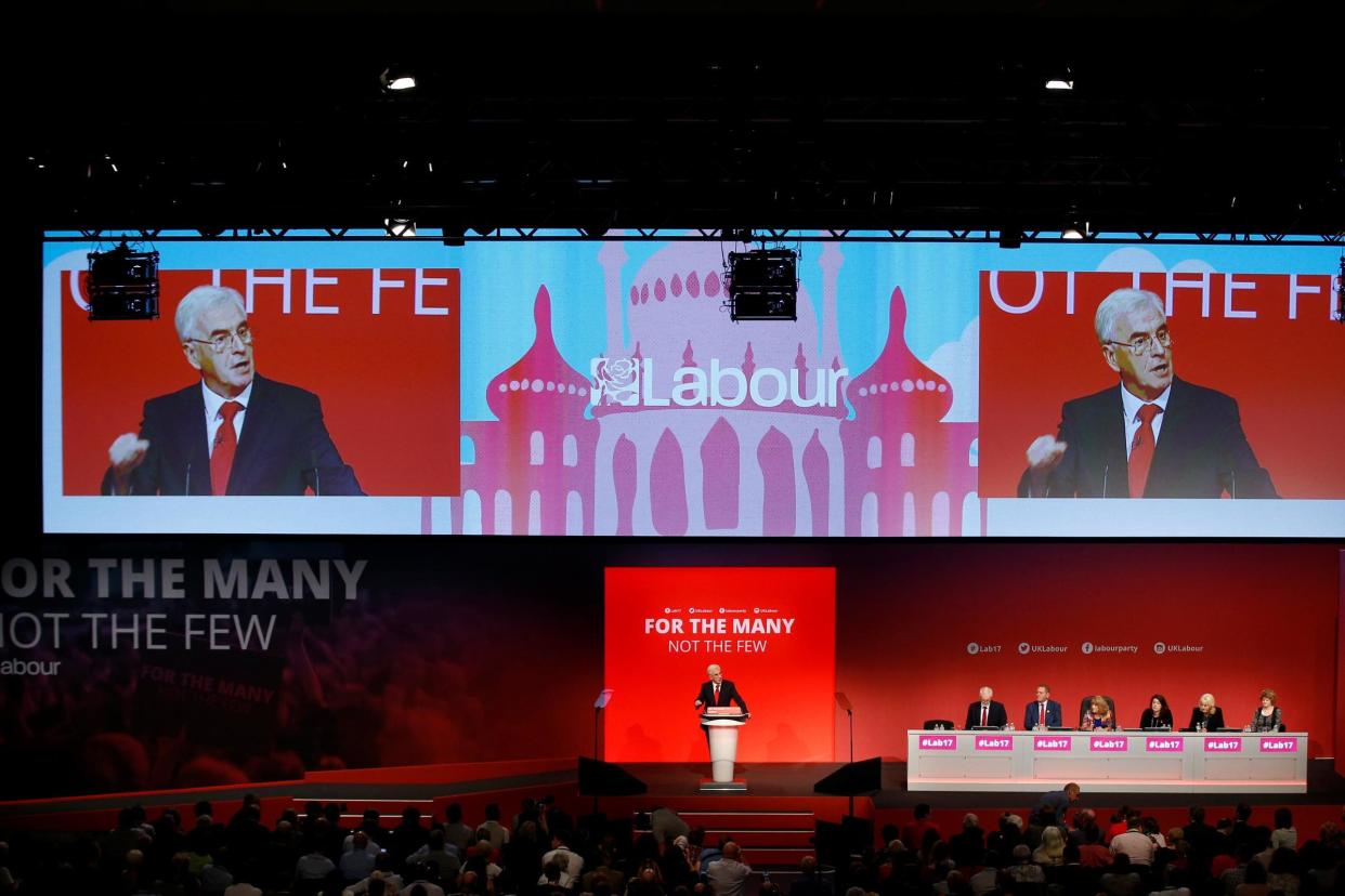 The Brighton pavilion is shown on a backdrop as shadow chancellor John McDonnell delivers his speech at the Labour conference: REUTERS