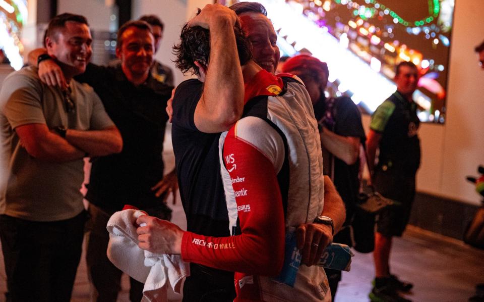 Oliver Bearman is hugged by his proud father, David