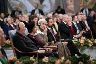 Norway's King Harold, Queen Sonja, Crown Princess Mette Marit and Crown Prince Haakon attend the Nobel Peace Prize Ceremony in Oslo Town Hall, Norway, Monday, Dec. 10, 2018. Dr. Denis Mukwege and Nadia Murad of Iraq, shared the 9-million Swedish kronor ($1 million) Nobel Peace Prize. Mukwege was honored for his work helping sexually abused women at the hospital he founded in the Democratic Republic of Congo. Murad, a Yazidi, won for her advocacy for sex abuse victims after being kidnapped by Islamic State militants. (Haakon Mosvold Larsen/Pool Photo via AP)