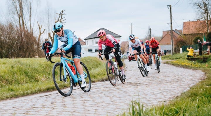 The breakaway hits the cobbles with Trek's Lisa Klein at the front
