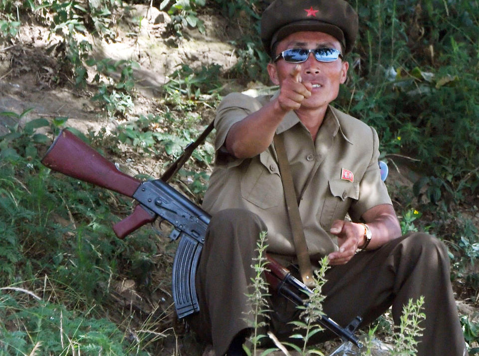 A North Korean soldier guards the border with China