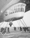 <p>Men adjusting the base under Hindenburg control room of the Zeppelin Hindenburg at Lakehurst, New Jersey. (George Rinhart/Corbis via Getty Images) </p>