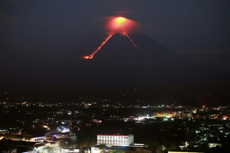 Lava spurting from Mayon volcano lights up the sky in what scientists said was a sign of increasing activity that prompted official calls for evacuation of areas under threat from a major eruption