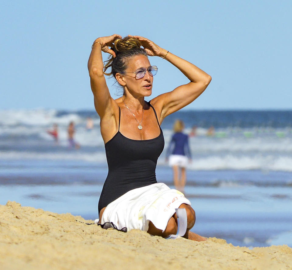 <p>Sarah Jessica Parker soaks up some sun during a solo visit to the beach in the Hamptons on Saturday.</p>