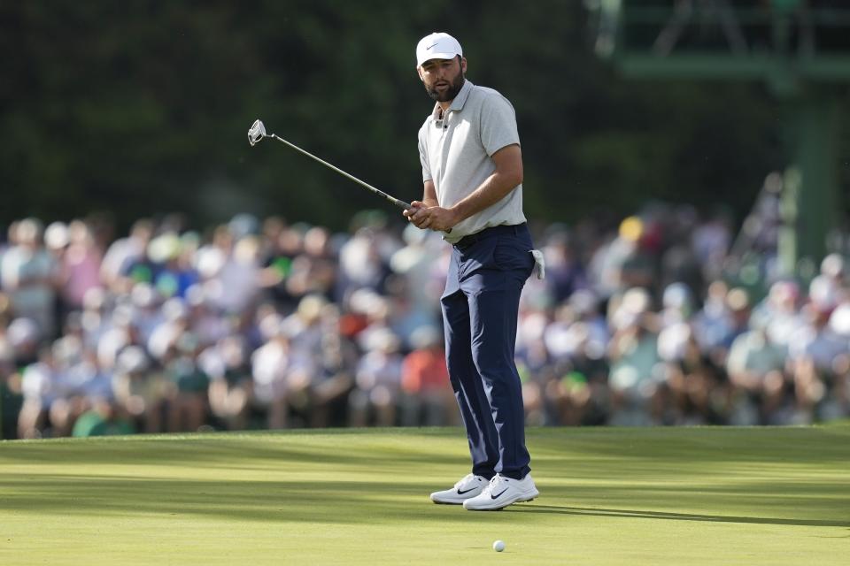 Scottie Scheffler reacts after missing a putt on the 15th hole during the first round at the Masters golf tournament at Augusta National Golf Club Thursday, April 11, 2024, in Augusta, Ga. (AP Photo/David J. Phillip)