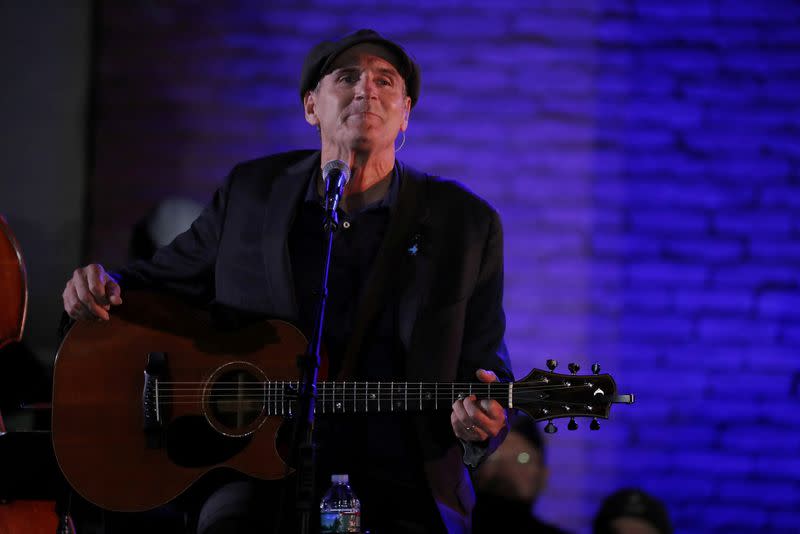 FILE PHOTO: Singer James Taylor performs before a campaign rally for U.S. Democratic presidential nominee Hillary Clinton in Manchester, New Hampshire