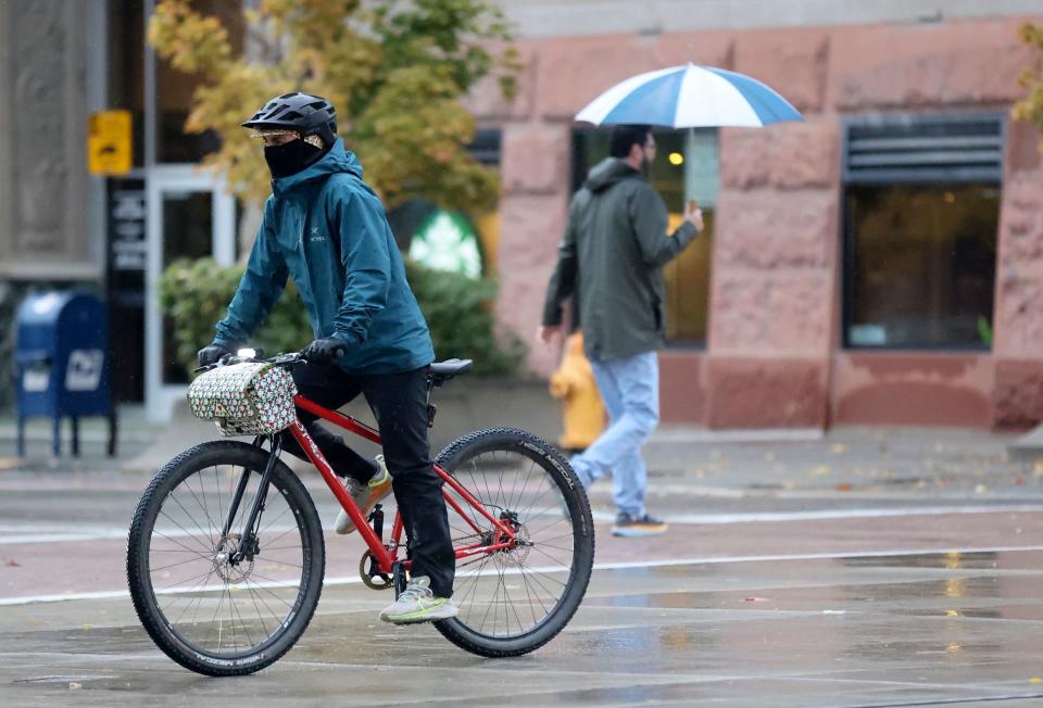 People bike and walk through downtown Salt Lake City on Thursday, Oct. 26, 2023. | Kristin Murphy, Deseret News