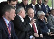 Formula One - F1 - Russian Grand Prix - Sochi, Russia - 30/04/17 - Russian President Vladimir Putin (3rd L) listens to F1 chairman Chase Carey during the race. Sputnik/Alexei Nikolsky/Kremlin via REUTERS