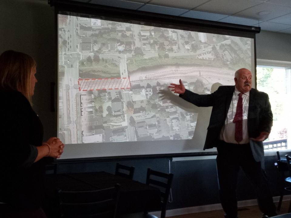 Brian Wilken, incoming GHP president, points out elements of the 12th Street connector project, part of the developing downtown Honesdale revitalization program being coordinated by GHP. At left is Emily Wood, representing Woodland Design, the design consultant contacted by GHP. The same firm is also designing the County of Wayne's planned Sycamore Point Park project at the former Industrial Park at the end of 12th Street where the Lackawaxen River bends. The presentation was at the Honesdale Golf Club on Sept. 20, 2023.