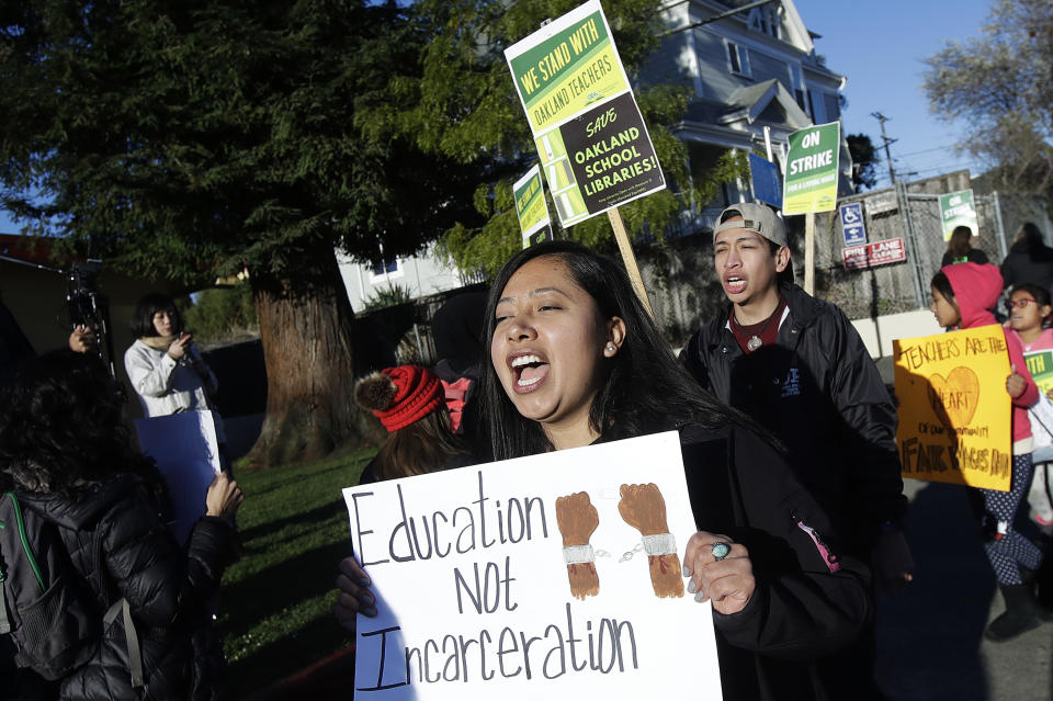 Roxana De La O Cortez, teacher at Manzanita SEED Elementary School, marches with other teachers and supporters in Oakland, Calif., Thursday, Feb. 21, 2019. Teachers in Oakland went on strike Thursday in the country's latest walkout by educators over classroom conditions and pay. (AP Photo/Jeff Chiu)