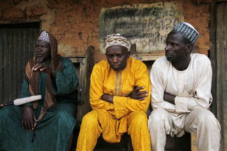 The leader of the displaced Fulani herdsmen Haruna Usman (L) sits next to men from his tribe during an exclusive interview with Reuters in Barkin Kogi, Zango Kataf, Kaduna State March 22, 2014. REUTERS/Afolabi Sotunde