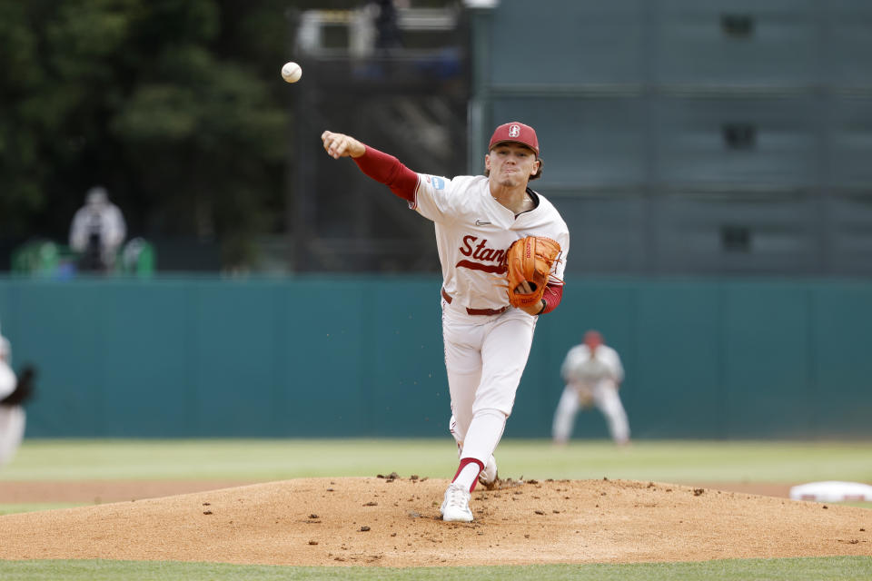 Stanford's Joey Dixon throws the first pitch against Texas in the first inning of an NCAA college baseball tournament super regional game in Stanford, Calif., Saturday, June 10, 2023. (AP Photo/Josie Lepe)