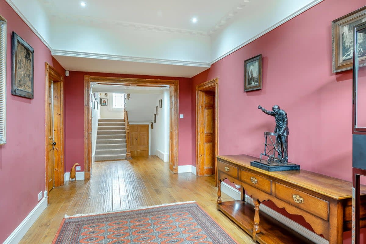 There is a statue of Captain Tom in the hallway (Rightmove / Fine & Country)
