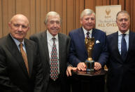 FILE - Members of the England 1966 World Cup winning team, from left, George Cohen, Gordon Banks, Martin Peters and Geoff Hurst pose for the media with the official English Football Association replica of the Jules Rimet trophy, at the Royal Garden Hotel in London Tuesday, Jan. 5, 2016. George Cohen, the right-back for England World Cup-winning team of 1966, has died aged 83, his former club Fulham have announced on Friday, Dec. 23, 2022. (AP Photo/Alastair Grant, File)