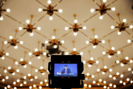 A screen shows Xu Shaoshi, head of the National Development and Reform Commission (NDRC) gestures as he speaks during a press conference on the sideline of National People's Congress in Beijing, China March 6, 2016. REUTERS/Damir Sagolj