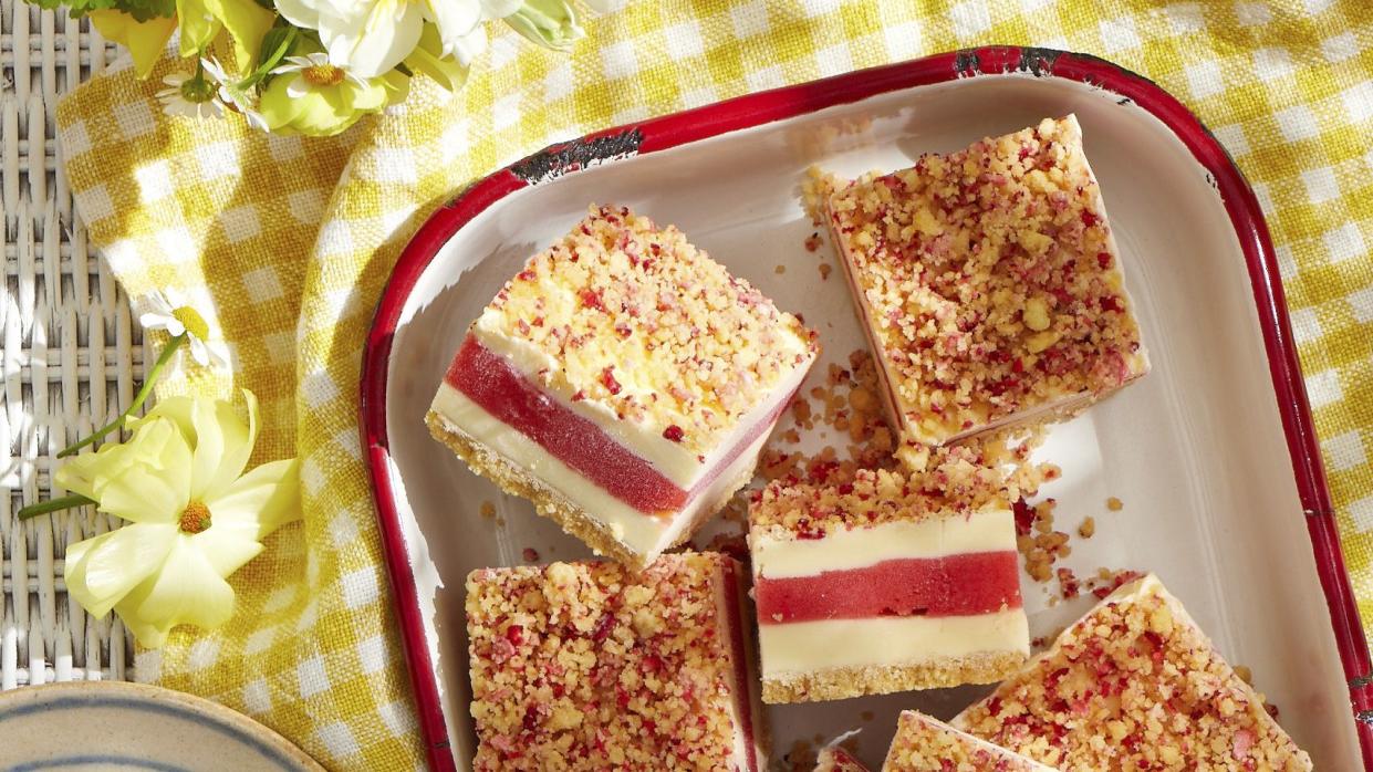 strawberry shortcake ice cream bars on a platter on a yellow cloth