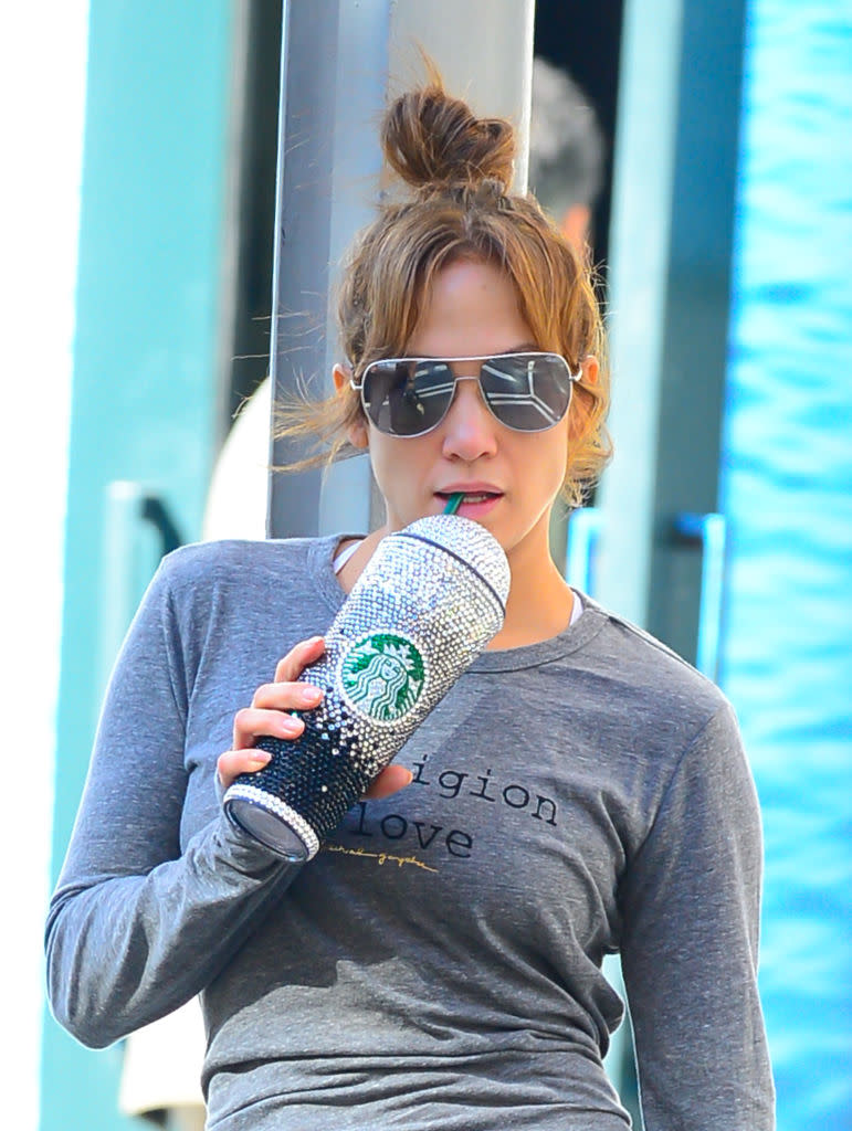 Jennifer Lopez drinks from a Swarovski-covered Starbucks cup
