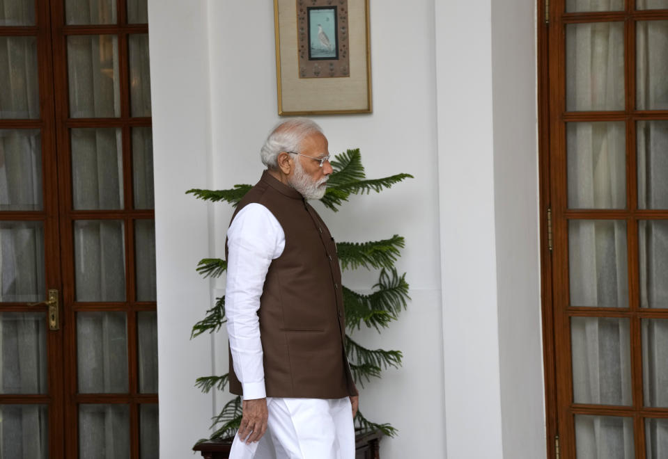 Indian Prime Minister Narendra Modi arrives to receive his Japanese counterpart Fumio Kishida before their delegation level meeting in New Delhi, India, Monday, March 20, 2023. (AP Photo/Manish Swarup)