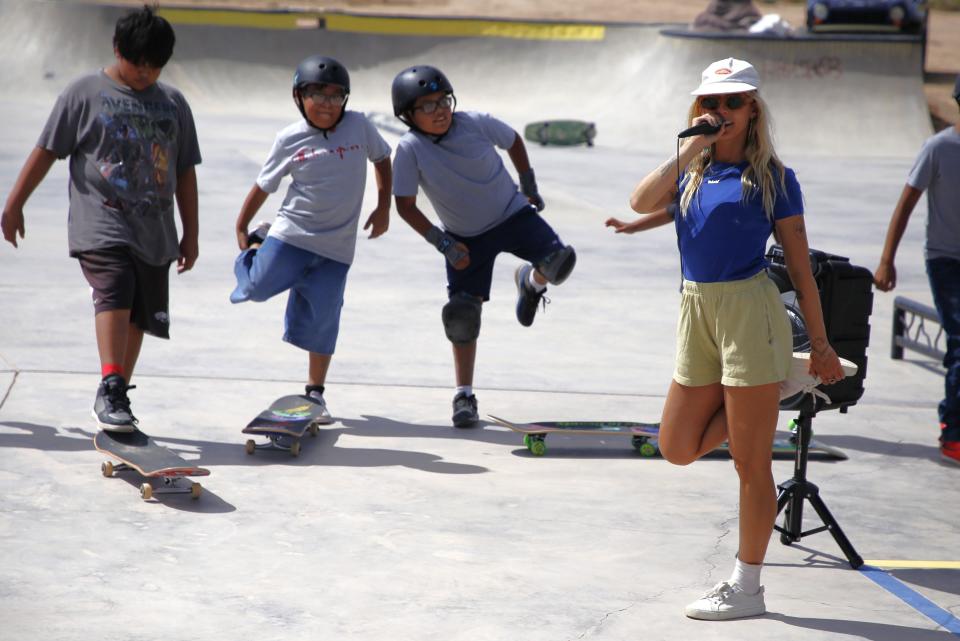 Lucy Osinski, right, of GrlSwirl leads participants in a series of stretching exercises during the opening session of the Modern Matriarch Skate Jam on Friday, Sept. 22 at the Two Grey Hills Skate Park in Two Grey Hills on the Navajo Nation.