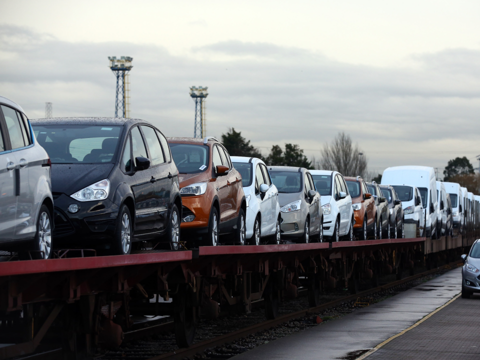 A row of Ford cars getting ready to be shipped.