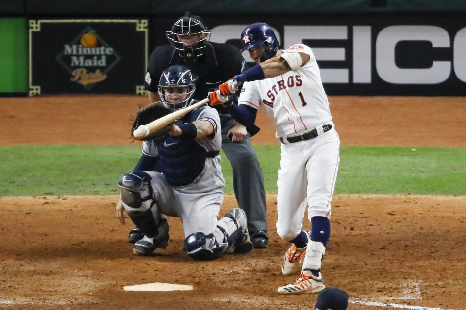 Houston Astros' Carlos Correa hits a walk-off home run against the New York Yankees during the 11th inning in Game 2 of baseball's American League Championship Series Sunday, Oct. 13, 2019, in Houston. (AP Photo/Sue Ogrocki)