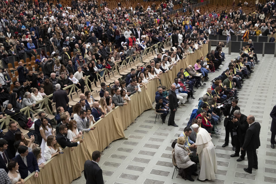 Pope Francis greets pilgrims in the Paul VI Hall at the Vatican during his weekly general audience, Wednesday, Dec. 11, 2019. (AP Photo/Alessandra Tarantino)