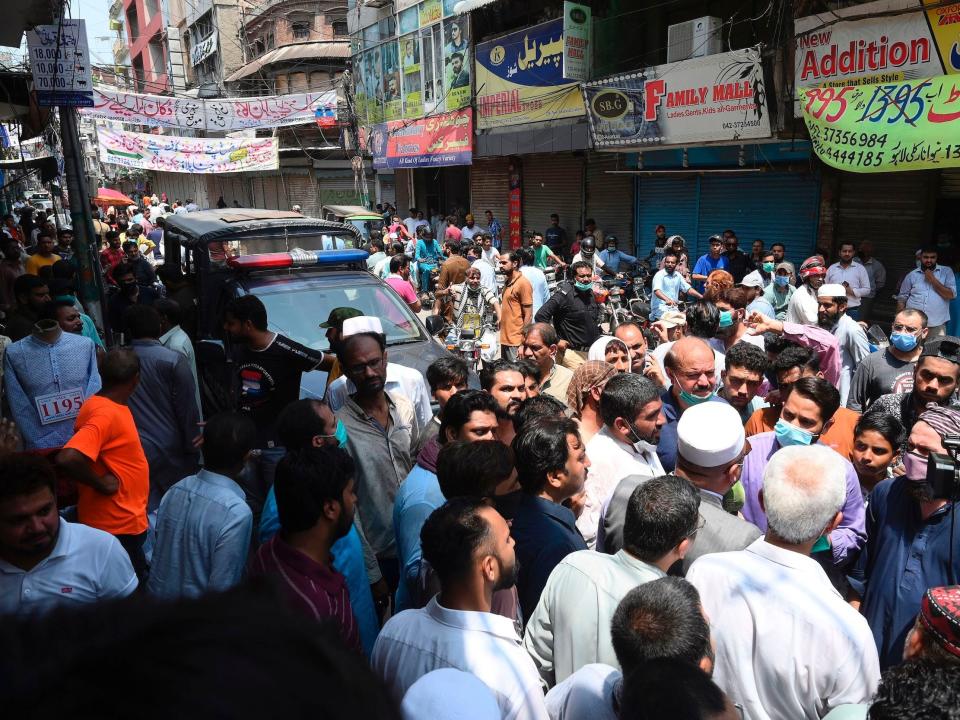 Traders gather as they protest beside their closed shops against a lockdown imposed by the Punjab provincial government in an effort to curb the spread of the COVID-19 coronavirus ahead of the Muslim festival Eid al-Adha or the 'Festival of Sacrifice', in Lahore on July 28, 2020. (Photo by Arif ALI / AFP) (Photo by ARIF ALI/AFP via Getty Images)
