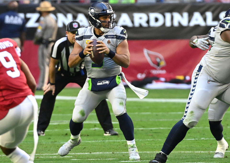 GLENDALE, ARIZONA - JANUARY 09: Russell Wilson #3 of the Seattle Seahawks looks to throw the ball during the first quarter against the Arizona Cardinals at State Farm Stadium on January 09, 2022 in Glendale, Arizona. (Photo by Norm Hall/Getty Images)