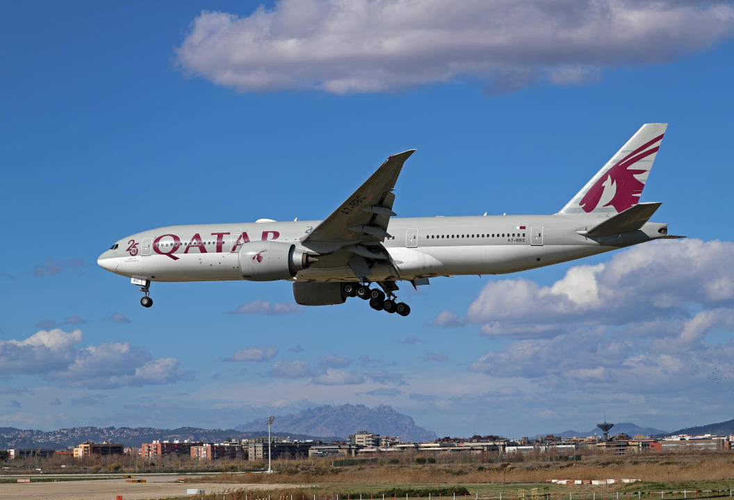 A Boeing 777-2DZ(LR) from Qatar Airways, featuring a '25 Years of Excellence' sticker, is landing at Barcelona Airport in Barcelona, Spain, on February 23, 2024. (Photo by Urbanandsport/NurPhoto via Getty Images)