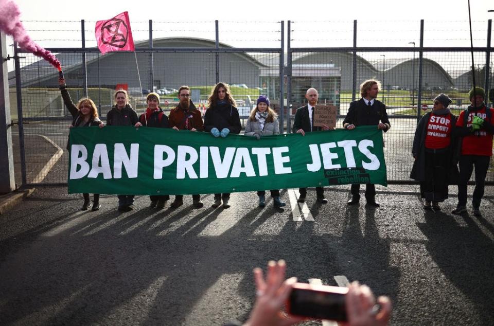 The use of private jets by celebrities and the wealthy has garnered international attention in recent years thanks to concerns about the carbon footprints they leave behind. Here, Swedish environmental activist Greta Thunberg takes part in a demonstration by the Extinction Rebellion (XR) climate change group at Farnborough Airport in Farnborough, England, on Jan. 27, 2024.
