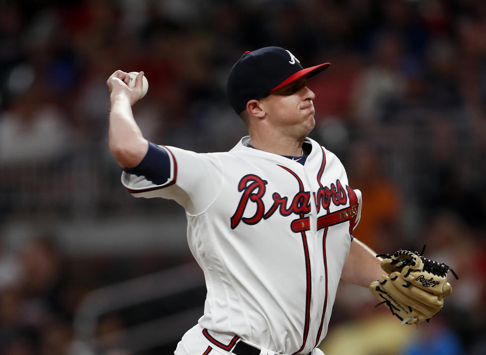 Atlanta Braves relief pitcher Brad Brach works in the seventh inning of a baseball game against the Miami Marlins Monday, July 30, 2018 in Atlanta. (AP Photo/John Bazemore)