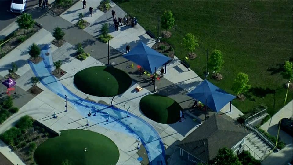 Police respond to the scene of a shooting at the Brooklands Plaza Splash Pad in Rochester Hills, Michigan, on Saturday, June 15, 2024. - WXYZ