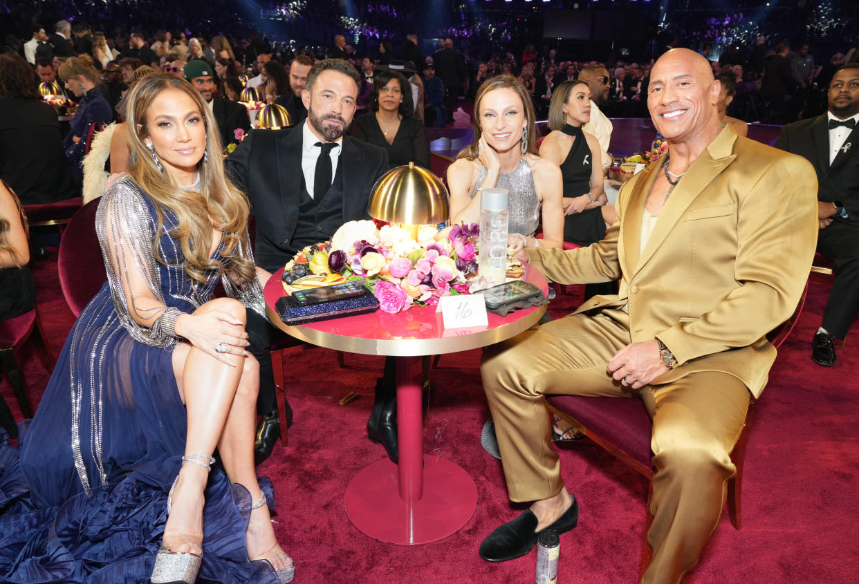 LOS ANGELES, CALIFORNIA - FEBRUARY 05: (L-R) Jennifer Lopez, Ben Affleck, Lauren Hashian, and Dwayne Johnson attend the 65th GRAMMY Awards at Crypto.com Arena on February 05, 2023 in Los Angeles, California. (Photo by Kevin Mazur/Getty Images for The Recording Academy)