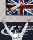 <p>Mercedes driver Lewis Hamilton of Britain throws his trophy into the air on the podium after winning the Spanish Formula One Grand Prix at the Barcelona Catalunya racetrack in Montmelo, Spain, Sunday, May 14, 2017. (Photo: Manu Fernandez/AP) </p>