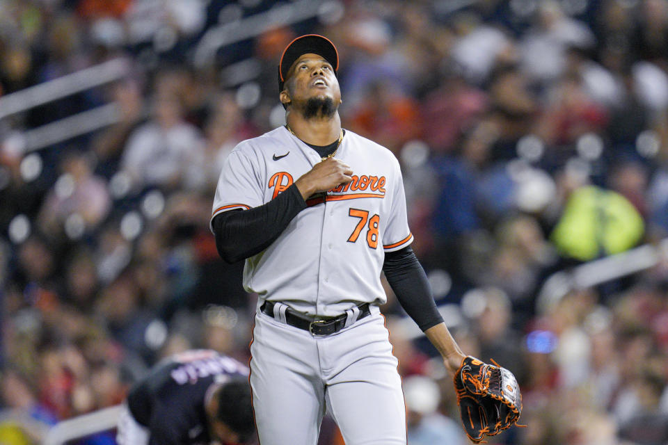 Baltimore Orioles relief pitcher Yennier Cano reacts after fielding a ball hit by Washington Nationals' Luis Garcia to end the eighth inning of a baseball game against the Washington Nationals at Nationals Park, Wednesday, April 19, 2023, in Washington. The Orioles won 4-0. (AP Photo/Jess Rapfogel)